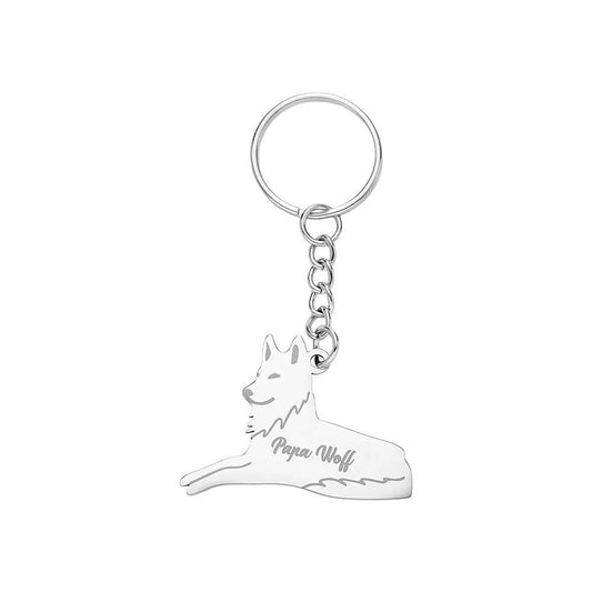 Close-up of a personalised stainless steel wolf family keyring engraved with names — engraved wolf family keyring, perfect personalised family gift