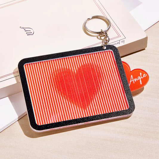 Personalised pull-out red heart keyring front view — acrylic engraved outer heart with hidden sparkly red centre, custom engraved gift for her