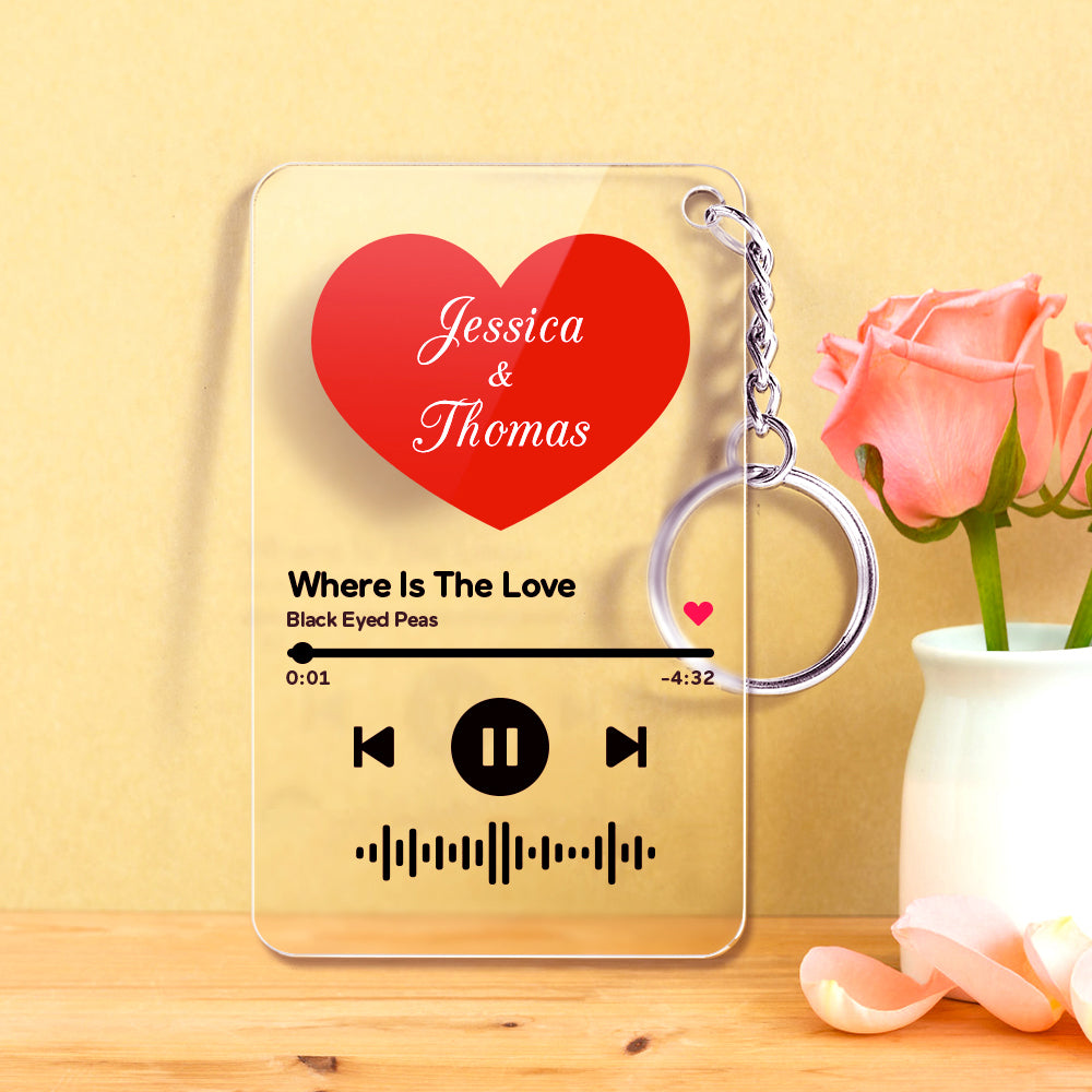 Personalised heart-shaped clear acrylic keyring with scannable Spotify code, custom song title and artist printed in pink and red – music acrylic keyring gift