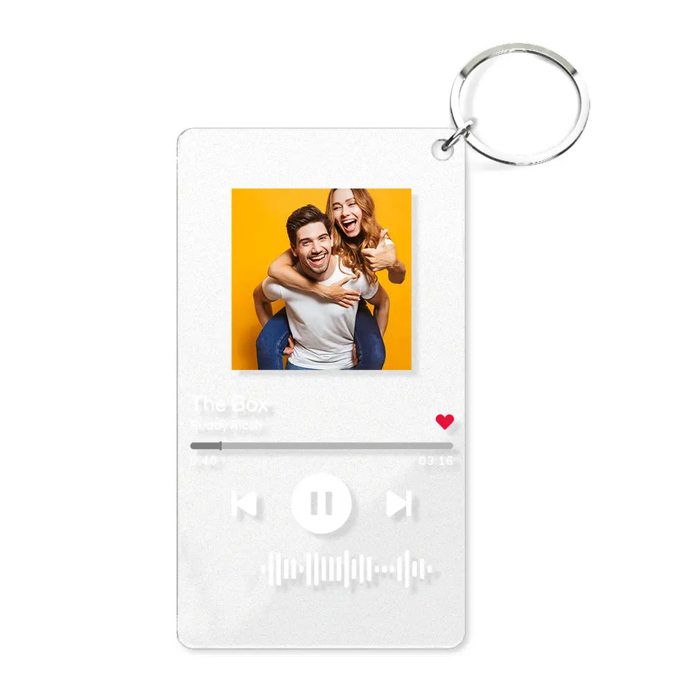 Close-up of clear acrylic personalised music code keyring with metal ring and visible scannable song code — custom song keychain for Mum