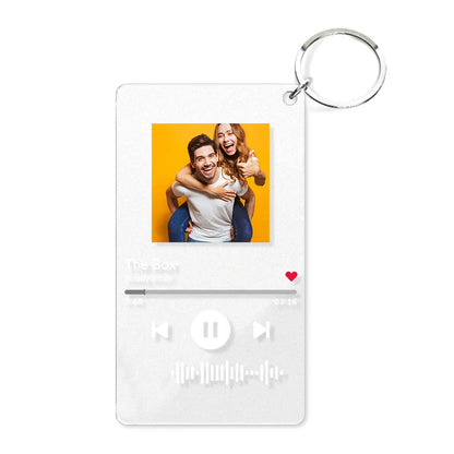 Close-up of clear acrylic personalised music code keyring with metal ring and visible scannable song code — custom song keychain for Mum