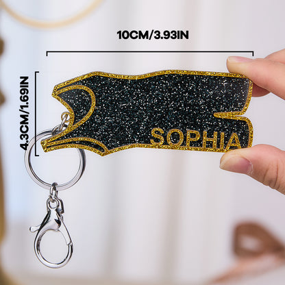 Custom wrestling keyring displayed next to medals and keys — personalised wrestling keychain ideal for tournament winners and coach gifts