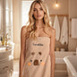 Personalised embroidered towel hanging in a stylish bathroom, thoughtful luxury gift for her or mum
