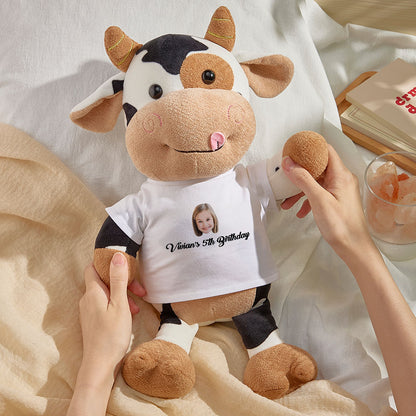 Close‑up of plush fabric and embroidered name on the personalised cow teddy with clear printed photo face and huggable PP cotton filling
