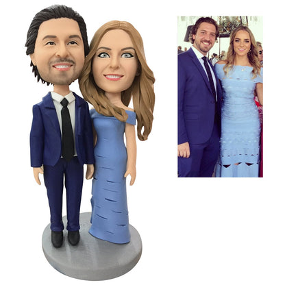 Personalised 2‑person bobbleheads displayed with optional hand accessories and base engraving — bespoke custom couple figurine in polymer clay