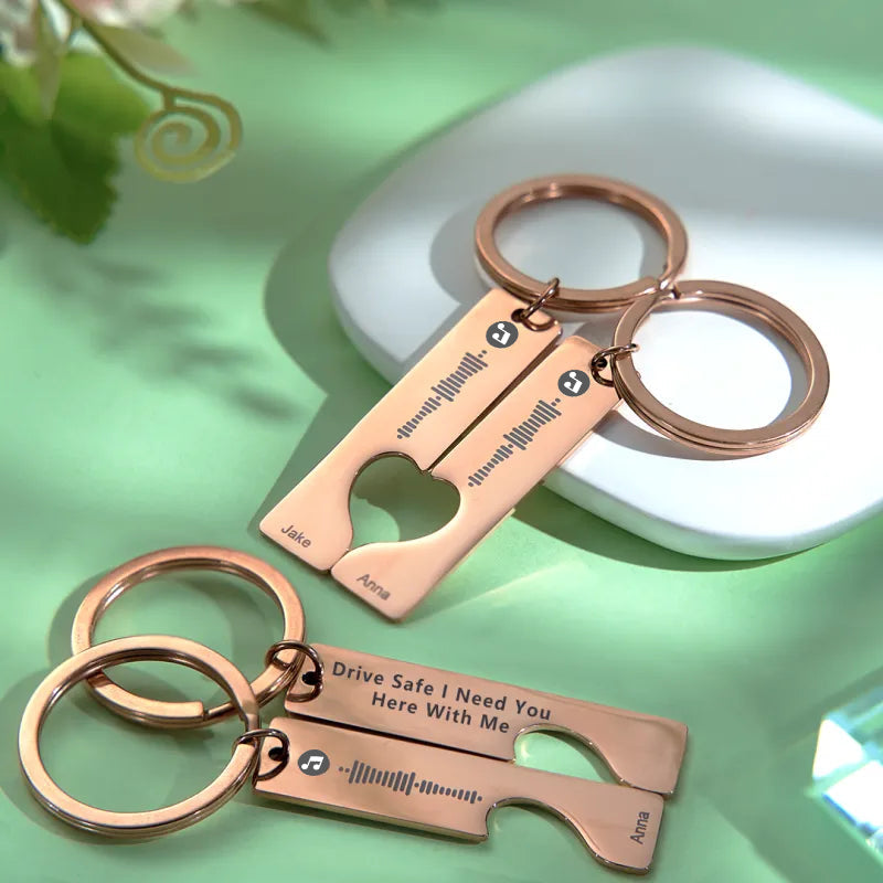 Detail shot of 3D‑engraved music scan code on stainless steel Drive Safe custom name keyring