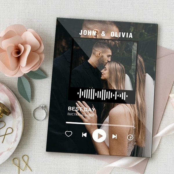 Compact personalised music QR code keychain beside a 12×16cm acrylic plaque — durable keepsake for couples, birthdays and anniversaries