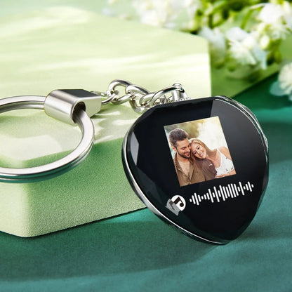 Couple holding personalised crystal photo and music keyring — romantic anniversary gift with scannable song