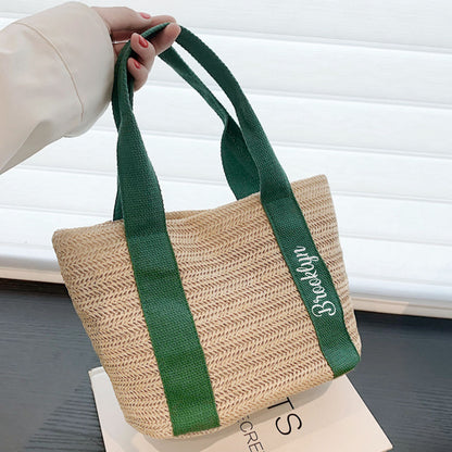 Bride-to-be carrying a personalised straw tote at the beach — custom bridal shower accessory and thoughtful wedding gift