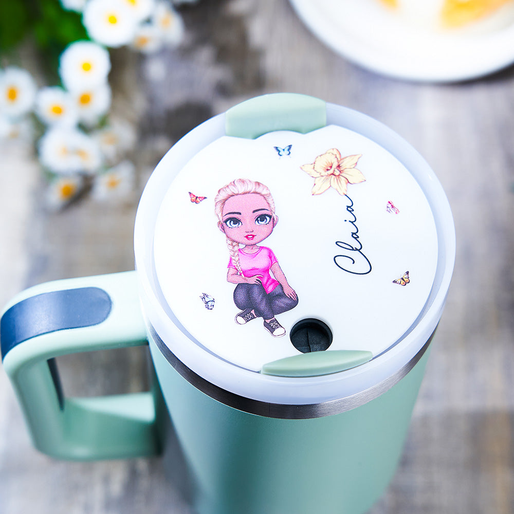Top view of personalised name tag lid topper for 40oz Stanley tumbler highlighting how the Cartoon Girl birth flower design sits on the lid