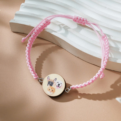 Detailed shot of wooden pendant with pet photo on personalised bracelet