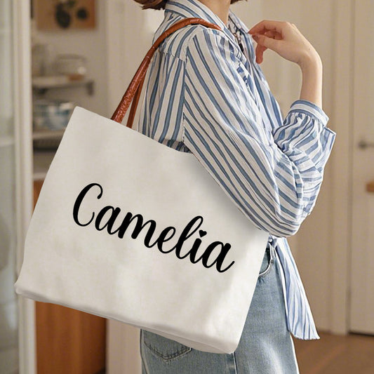 Front view of personalised name canvas tote bag with magnetic buckle, PU leather trim and leather-style handles — ideal gift for her