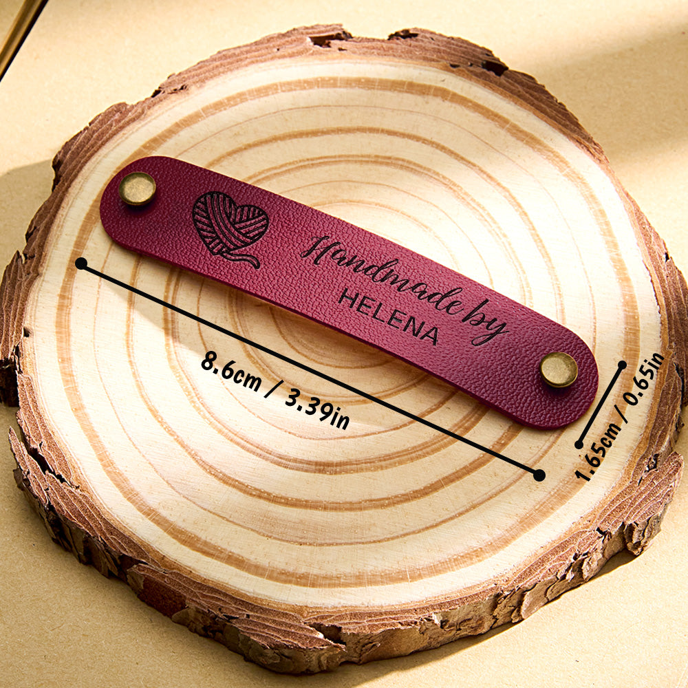 Ten personalised PVC tags laid out to show size 8.6cm x 1.65cm and finish