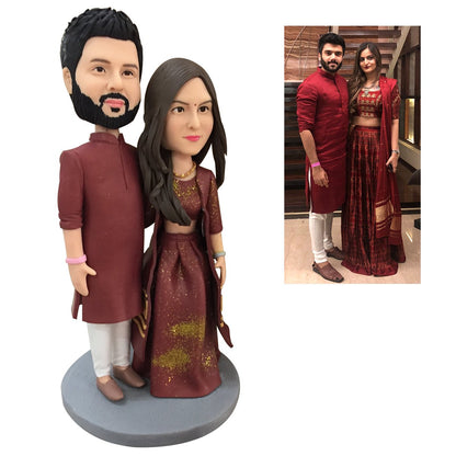 Close-up of personalised couple bobblehead heads showing facial likeness and hairstyle detail on handcrafted polymer clay custom figurine