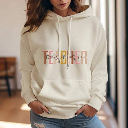 Detailed close-up of custom name print on personalised teacher hooded sweatshirt — high-quality finish on polyester fabric for a lasting back-to-school gift
