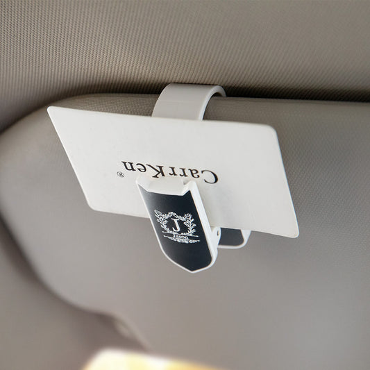 Personalised Car Sunglasses Holder on a sun visor with a custom name, showcasing a compact low-profile clip made from durable ABS plastic.
