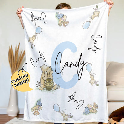 Side view of the Pooh name blanket highlighting plush flannel material.