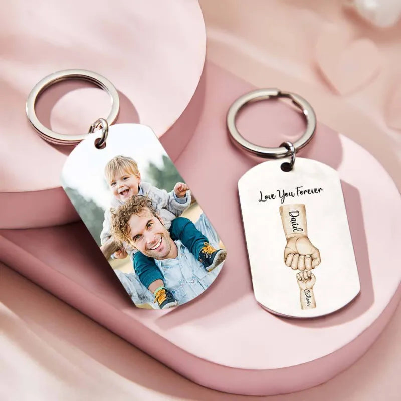 Personalised bump keychain displaying custom photo on the front and engraved fists on the reverse – bespoke Father's Day photo keyring