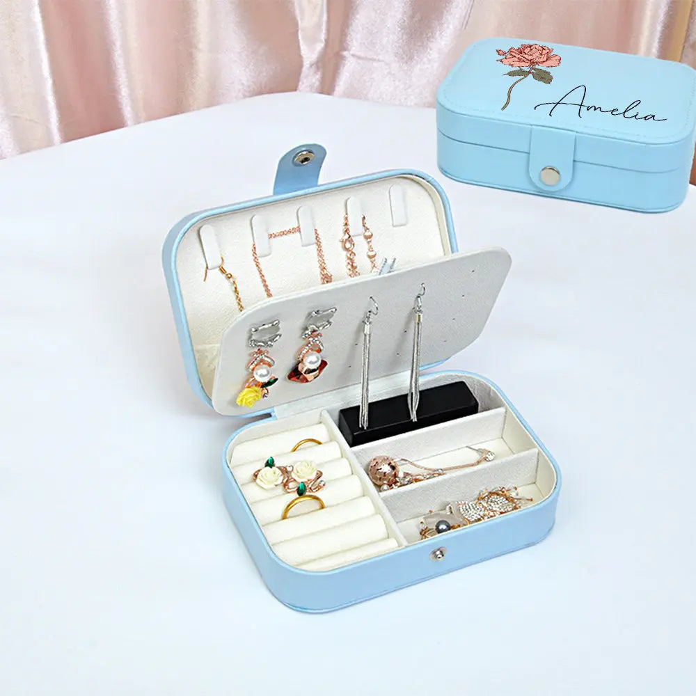 Multi-compartment interior with necklace hooks and zip pocket to keep chains untangled — travel jewellery organiser