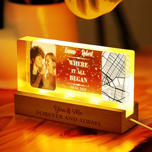 Close-up of the personalised night light showing the etched map design and photo on acrylic, warm ambient glow