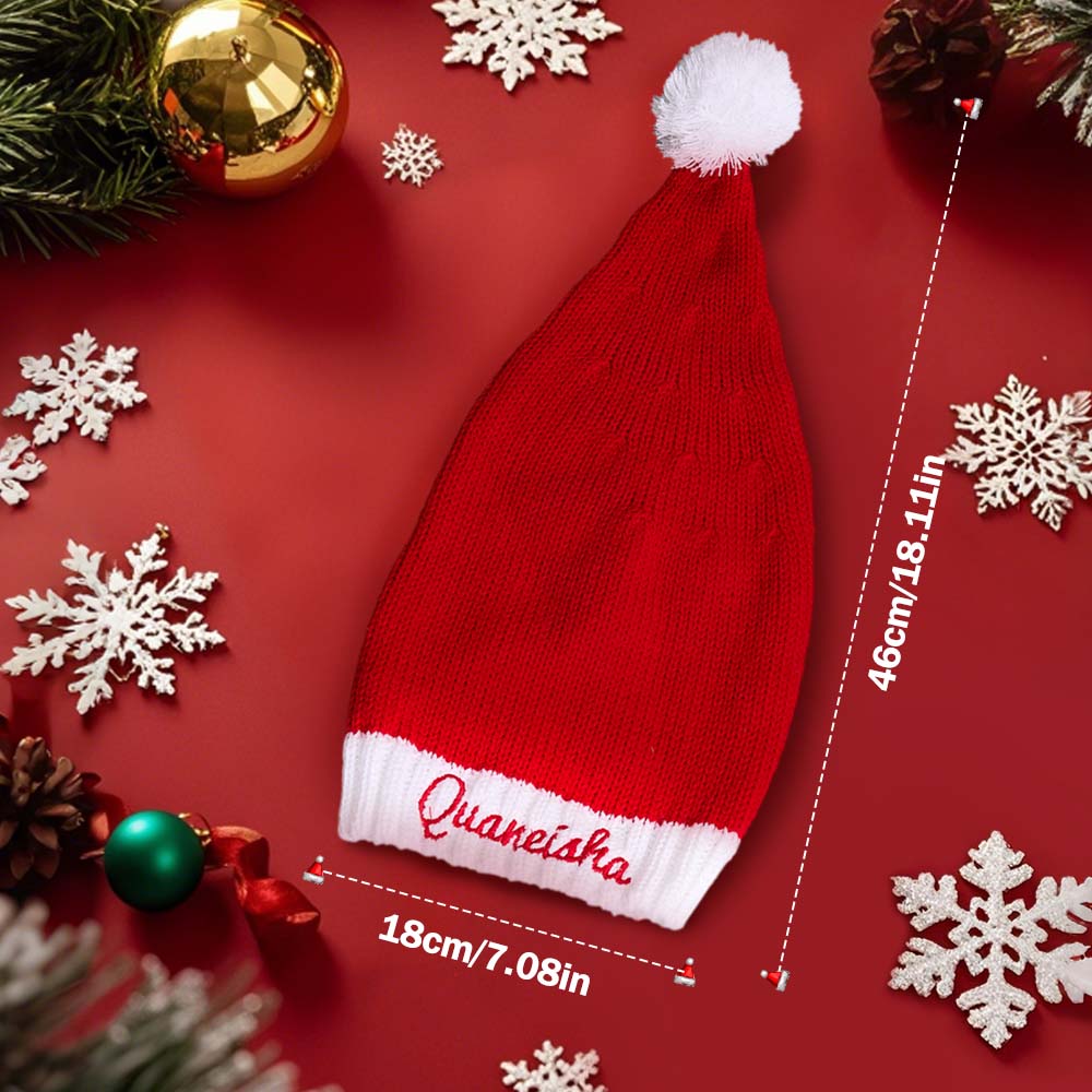 Adult and child wearing matching personalised embroidered Santa hats — festive family photo idea with custom names