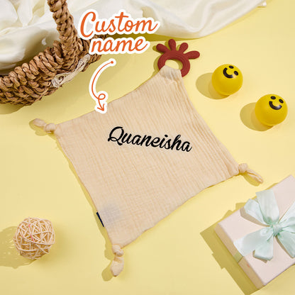 Baby cuddling a Personalised Soothe Towel comforter with embroidered name for soothing sleep and added security