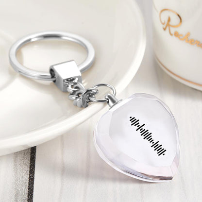 Heart-shaped music crystal keyring attached to keys to show portability — personalised engraved keepsake with scannable song code