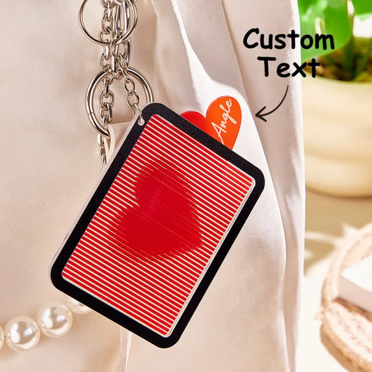 Personalised pull-out red heart keyring front view — acrylic engraved outer heart with hidden sparkly red centre, custom engraved gift for her