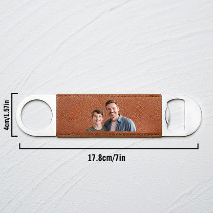 Close-up shot of the printed photo on the leather handle with metal opener.