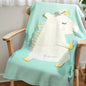 Close-up of embroidery detail showing the name on the unicorn blanket