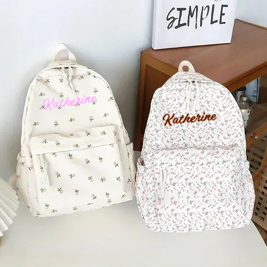 Personalised flower girl schoolbag front view – custom name on pink floral nylon student backpack, 31x13x40cm