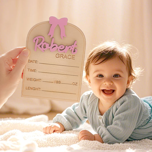 Personalised Baby Name Sign with coquette bow on wooden plaque showing custom birth info for nursery