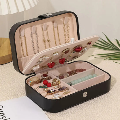 Open personalised travel jewellery box showing cushioned ring rolls and earring compartments — neat storage for rings and studs