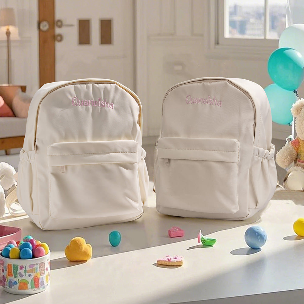 Child wearing personalised rabbit ear backpack — embroidered kids school bag with adjustable padded straps ideal for school and play