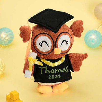 Close-up of printed custom name and graduation date on a soft owl plush – personalised graduation gift detail