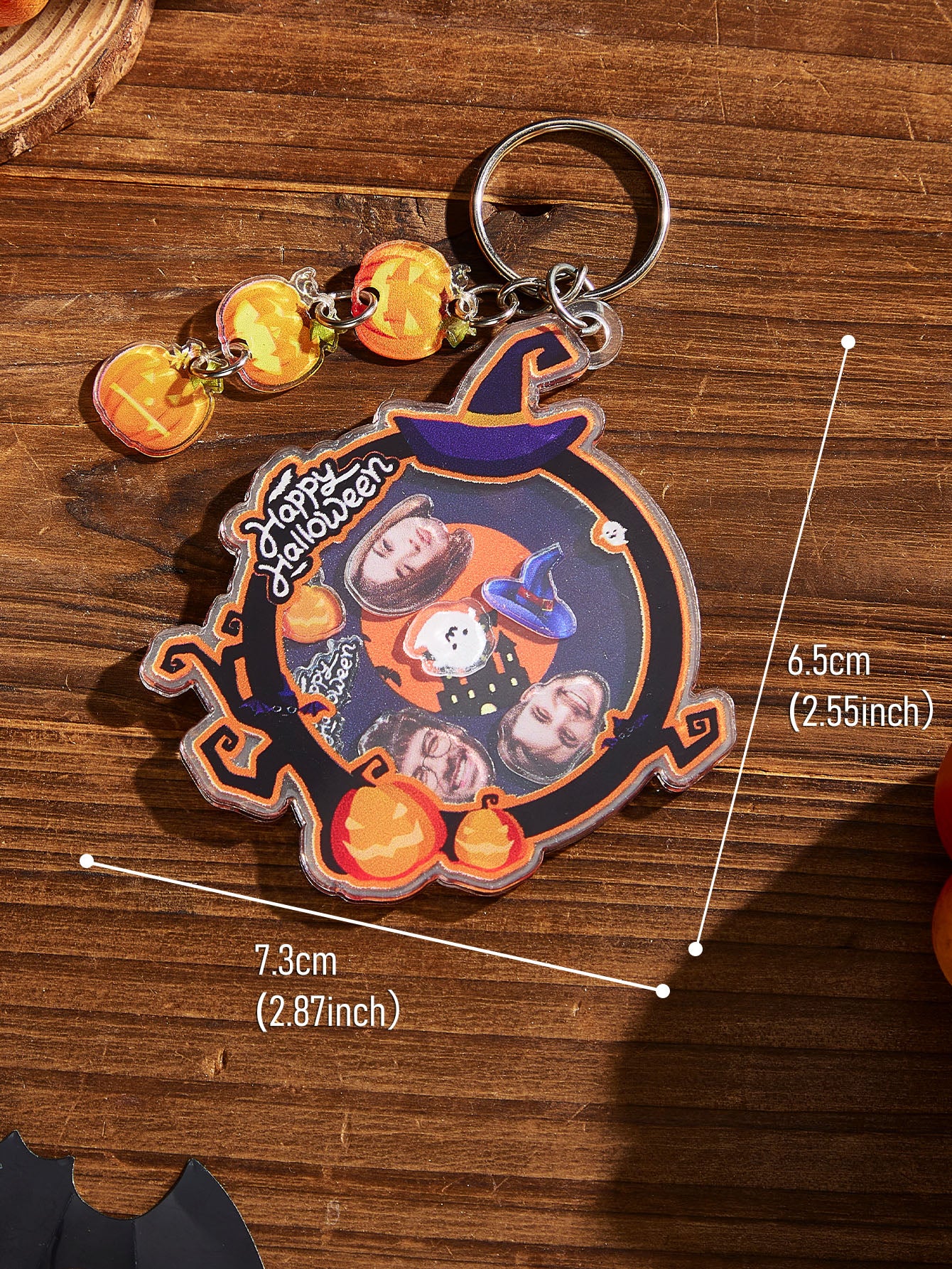 Close-up of humorous face artwork on acrylic keyring with glossy finish and vibrant print for a funny Hallowmas gift