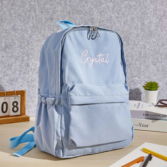 Front view of personalised embroidered name canvas backpack for kids showing custom name and main compartment, personalised school bag back to school gift