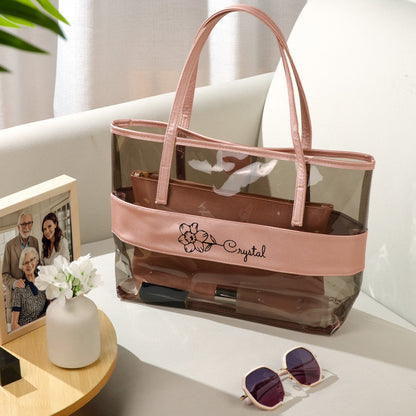 Lifestyle image of personalised birth flower clear tote being carried, stylish bridesmaid and wedding gift idea for mum or friends