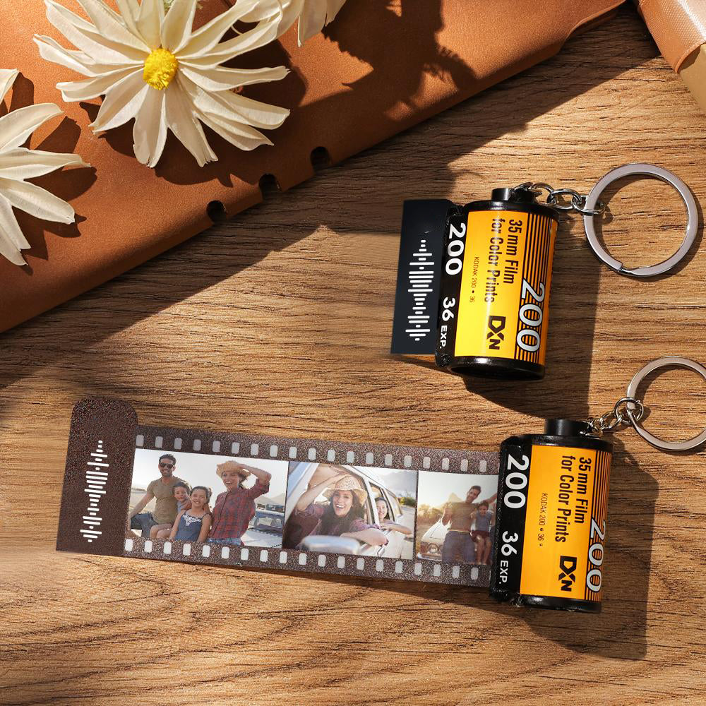 Front view of the film-roll keychain with a durable metal key ring and photo-loaded film strip.