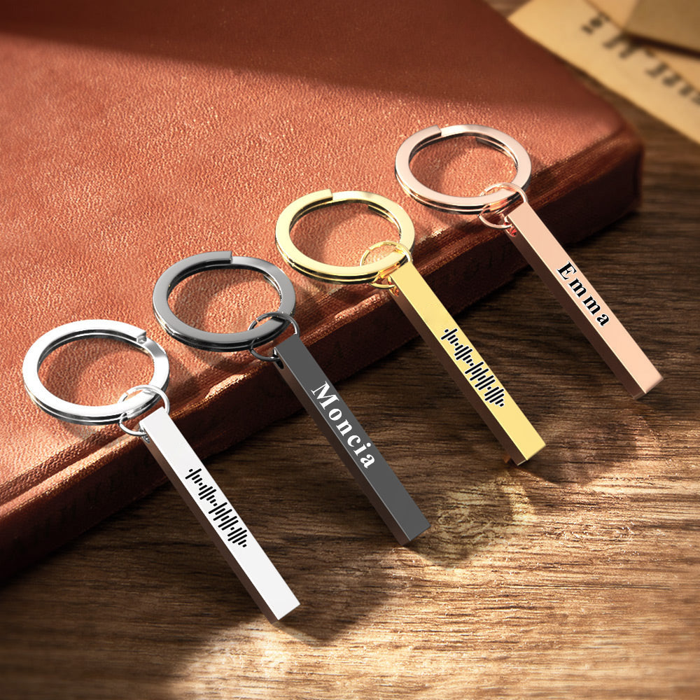 Close-up of engraved Spotify music code on personalised stainless steel 3D bar keychain showing double-sided laser engraving
