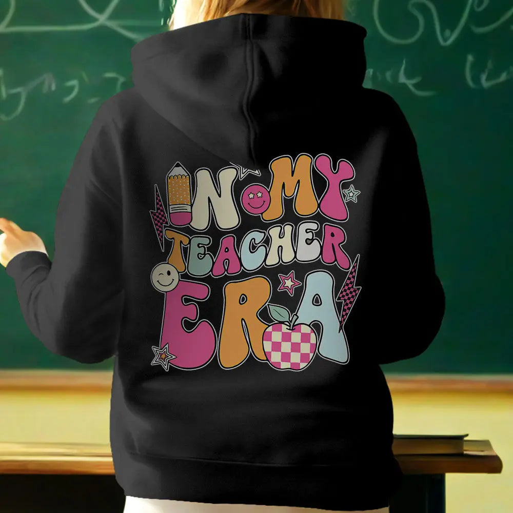 Teacher wearing personalised 'In My Teacher Era' hooded sweatshirt — styled outfit idea for school staff and classroom wear