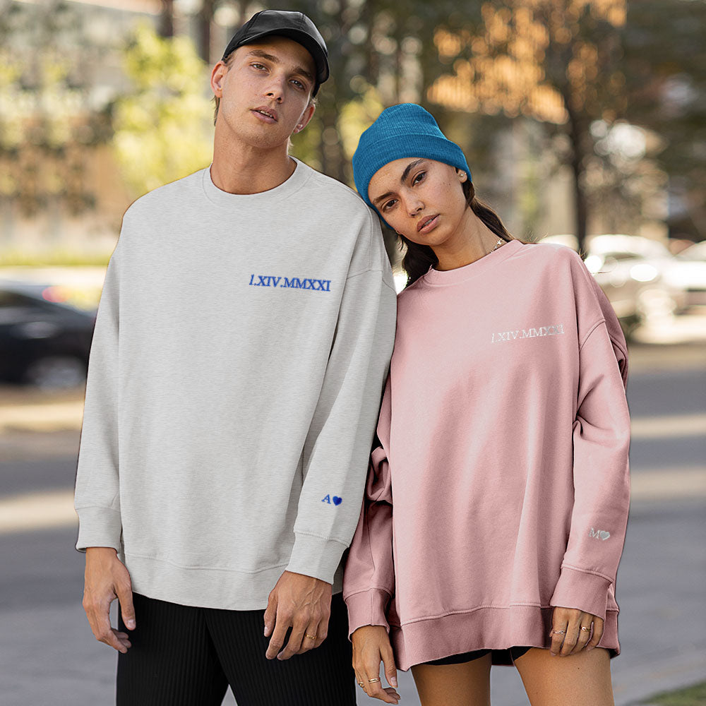 Romantic couple wearing matching personalised hoodies embroidered with their special date — ideal Valentine’s Day gift