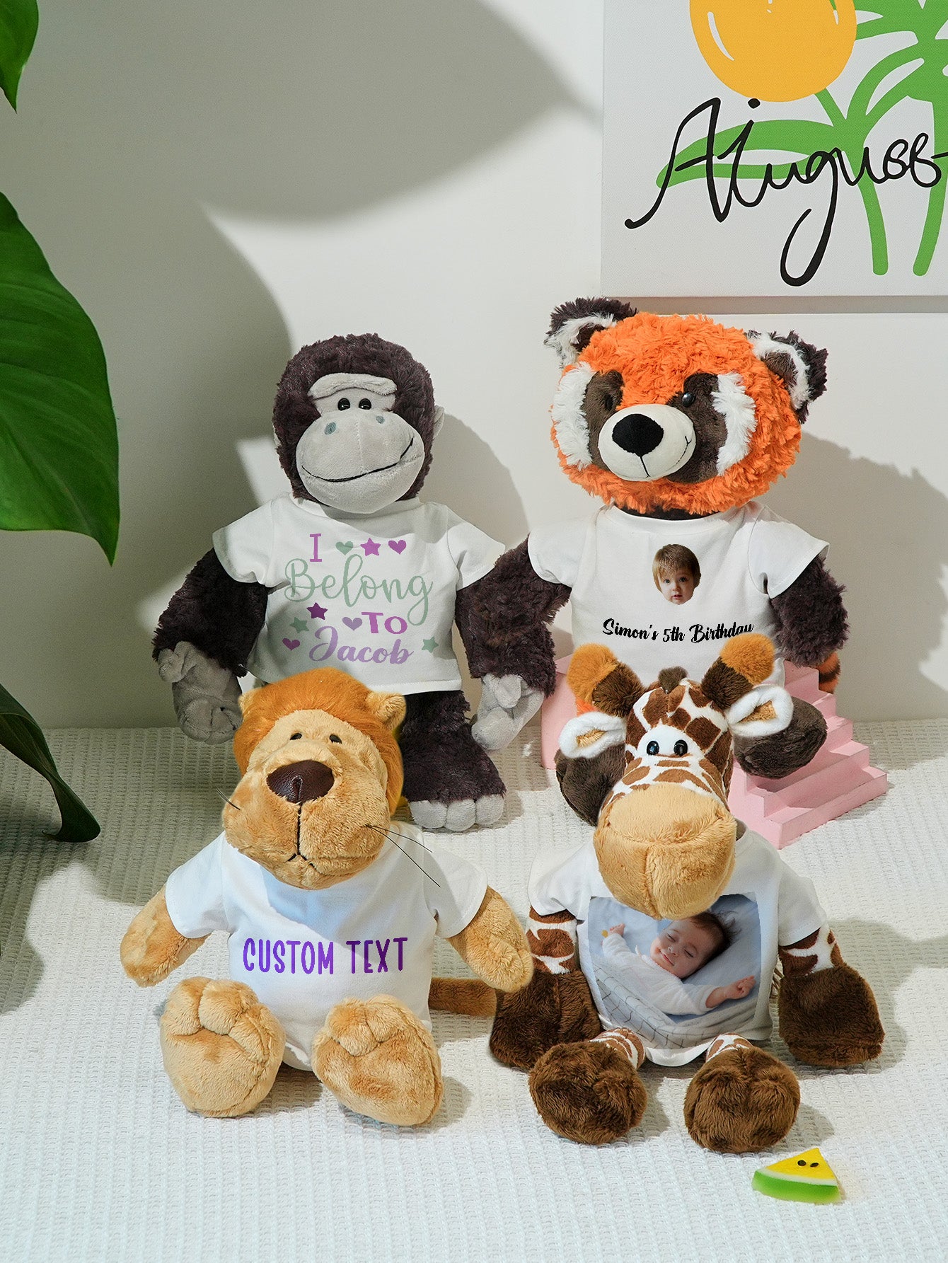 Close-up of customised embroidered name on plush clothing — personalised birth announcement keepsake detail