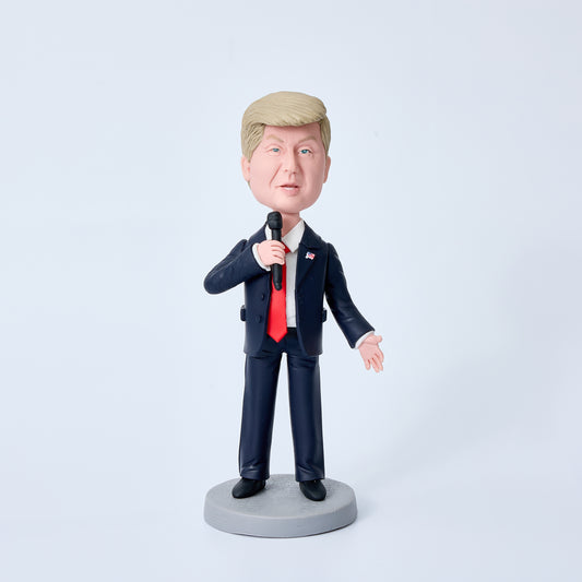 Donald Trump bobblehead in black suit holding a microphone, special edition polymer clay desk ornament and political collectable gift
