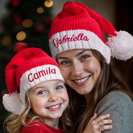 Personalised embroidered Santa hat with custom name on a classic red and white Christmas hat — perfect personalised name gift for family photos