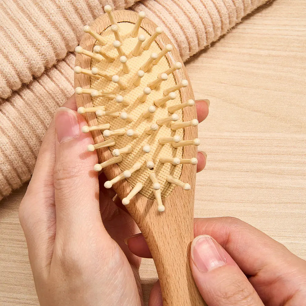 Examples of personalised engraving styles on the wooden brush — custom name options for an engraved baby brush keepsake
