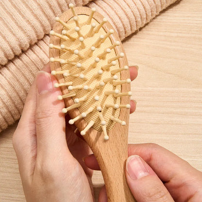 Examples of personalised engraving styles on the wooden brush — custom name options for an engraved baby brush keepsake