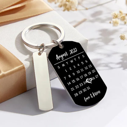 Smartphone scanning the scannable music code on a personalised photo calendar keyring to play a chosen song — romantic keepsake