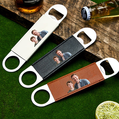 Close-up of the bottle opener displaying the printed photo on the leather handle.