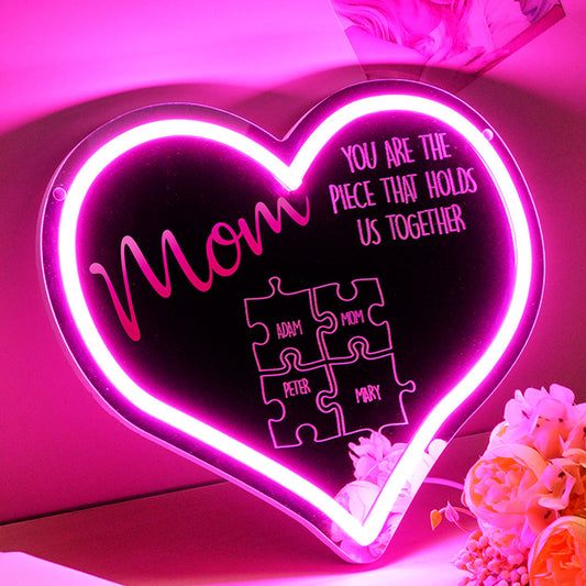 Personalised Mum Puzzle Sign neon light front view showing children's names around 'You Are the Piece That Holds Us Together' – Mother's Day personalised acrylic LED gift, 29.5cm x 25.6cm